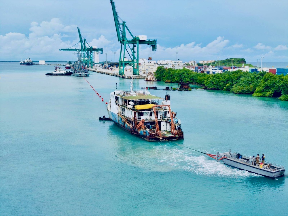 U.S. Navy, U.S. Coast Guard, Port of Guam refloat motor vessel Voyager