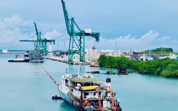 U.S. Navy, U.S. Coast Guard, Port of Guam refloat motor vessel Voyager