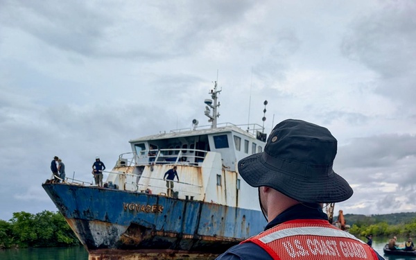 U.S. Navy, U.S. Coast Guard, Port of Guam refloat motor vessel Voyager