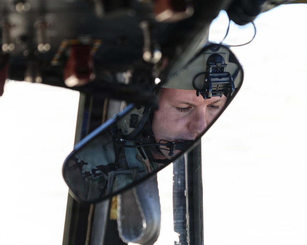 82nd Airborne CH-47 Chinook Pilot Prepares to Conduct Combined Arms Field Exercise with SOF Civil Affairs
