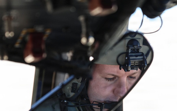 82nd Airborne CH-47 Chinook Pilot Prepares to Conduct Combined Arms Field Exercise with SOF Civil Affairs