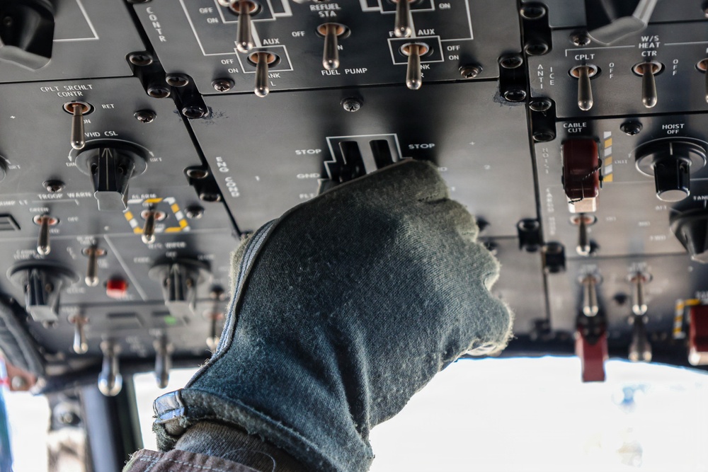 82nd Airborne CH-47 Chinook Pilot Checks Equipment Prior to a Combined Arms Field Exercise with SOF Civil Affairs