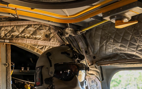 82nd Airborne CH-47 Chinook Crew Chief Prepares for Flight at a Combined Arms Field Exercise with SOF Civil Affairs