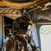 82nd Airborne CH-47 Chinook Crew Chief Prepares for Flight at a Combined Arms Field Exercise with SOF Civil Affairs