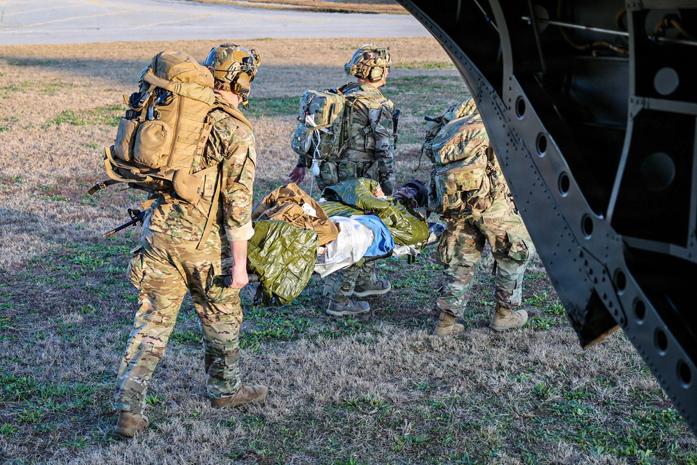 SOF Civil Affairs Soldiers Evacuate a Simulated Combat Casualty in a Recent Combined Arms Field Exercise with a 82nd Airborne CH-47 Chinook Crew