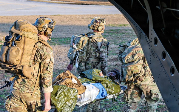 SOF Civil Affairs Soldiers Evacuate a Simulated Combat Casualty in a Recent Combined Arms Field Exercise with a 82nd Airborne CH-47 Chinook Crew