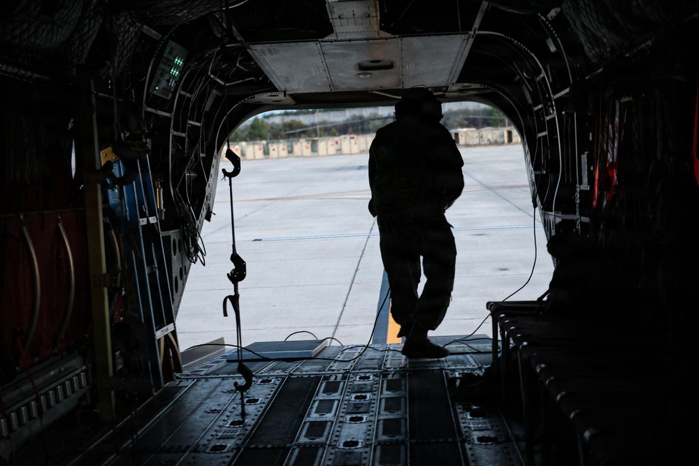 82nd Airborne CH-47 Chinook Crew Chief Prepares Ramp for Flight at a Combined Arms Field Exercise with SOF Civil Affairs