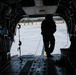 82nd Airborne CH-47 Chinook Crew Chief Prepares Ramp for Flight at a Combined Arms Field Exercise with SOF Civil Affairs