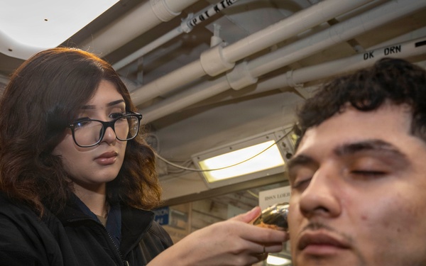 Sailor Provides A Haircut