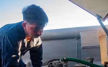 USS Boxer Fire Controlman conducts CIWS maintenance