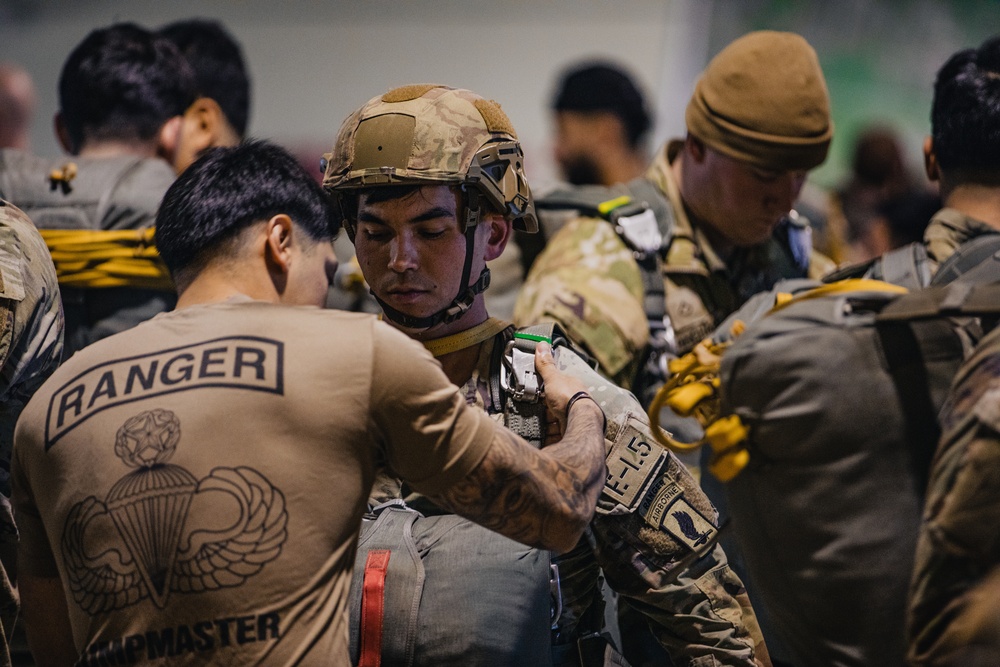 U.S. and Allied paratroopers conduct multinational holiday jump in Italy.