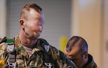 U.S. and Allied paratroopers conduct multinational holiday jump in Italy.