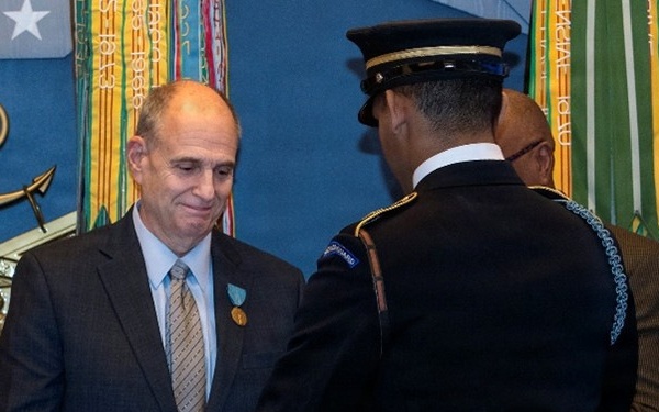 ‘Deep sense of service’ drives public health expert to protect warfighters, recognized by Department of War