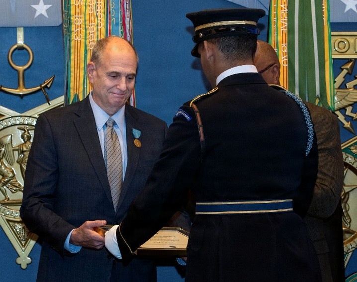 ‘Deep sense of service’ drives public health expert to protect warfighters, recognized by Department of War