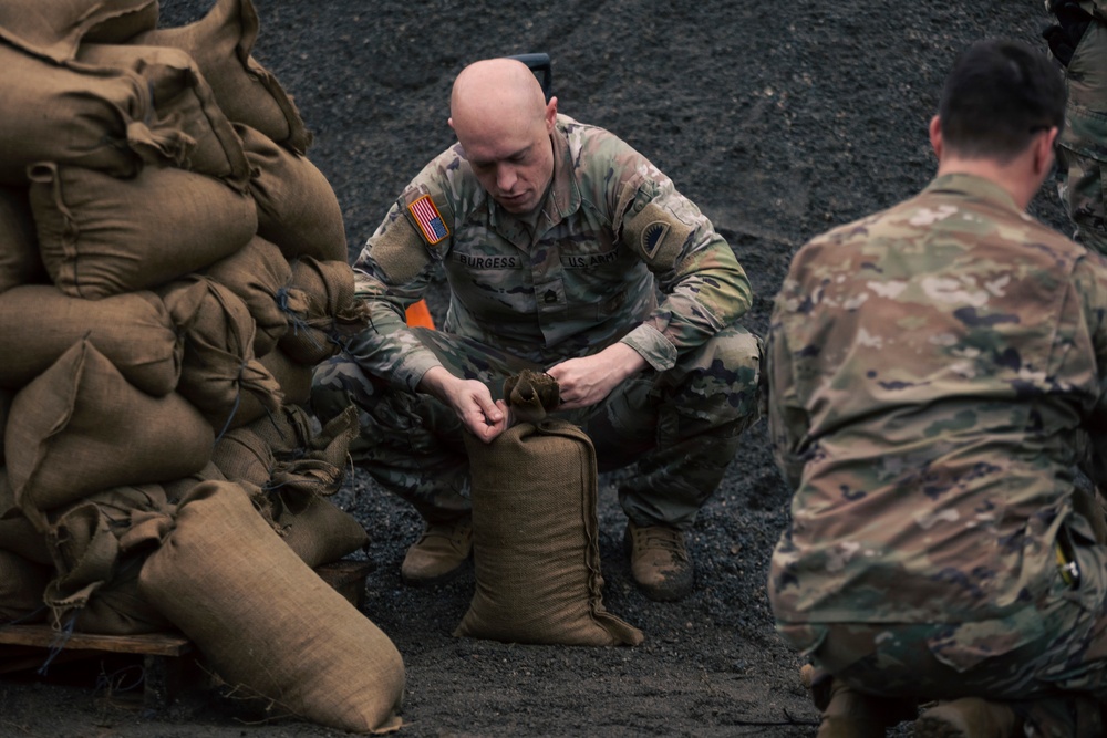 Guard personnel conduct sand bag filling operations in Skagit County