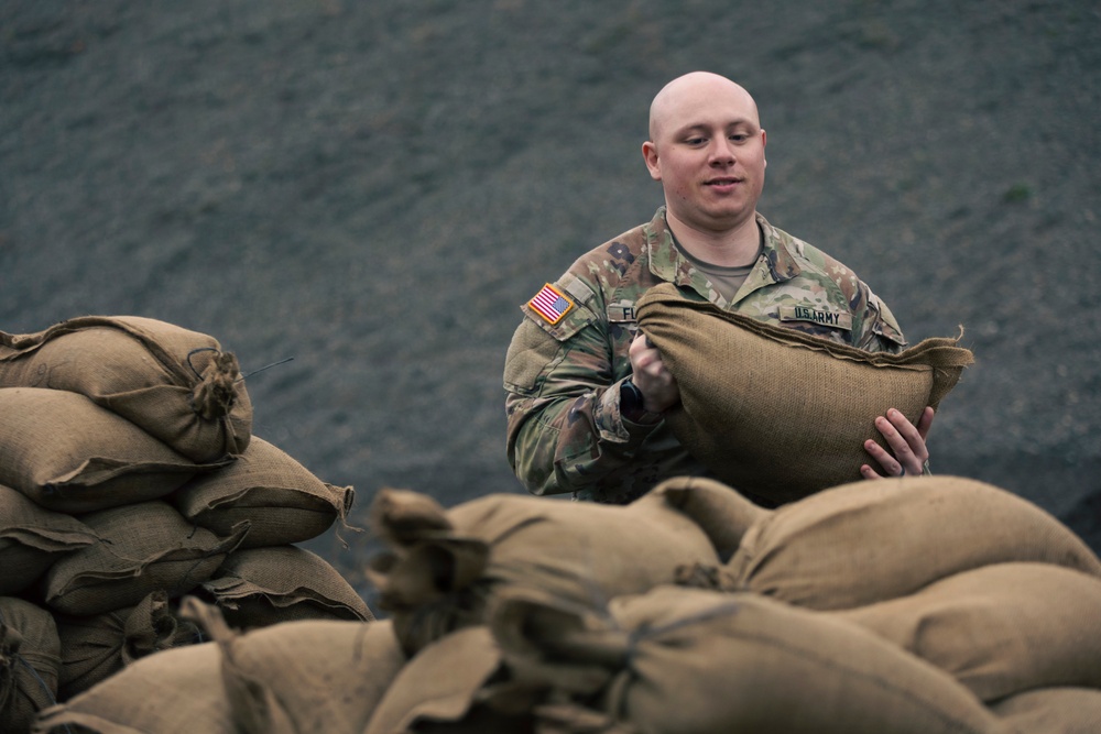 Guard personnel conduct sand bag filling operations in Skagit County