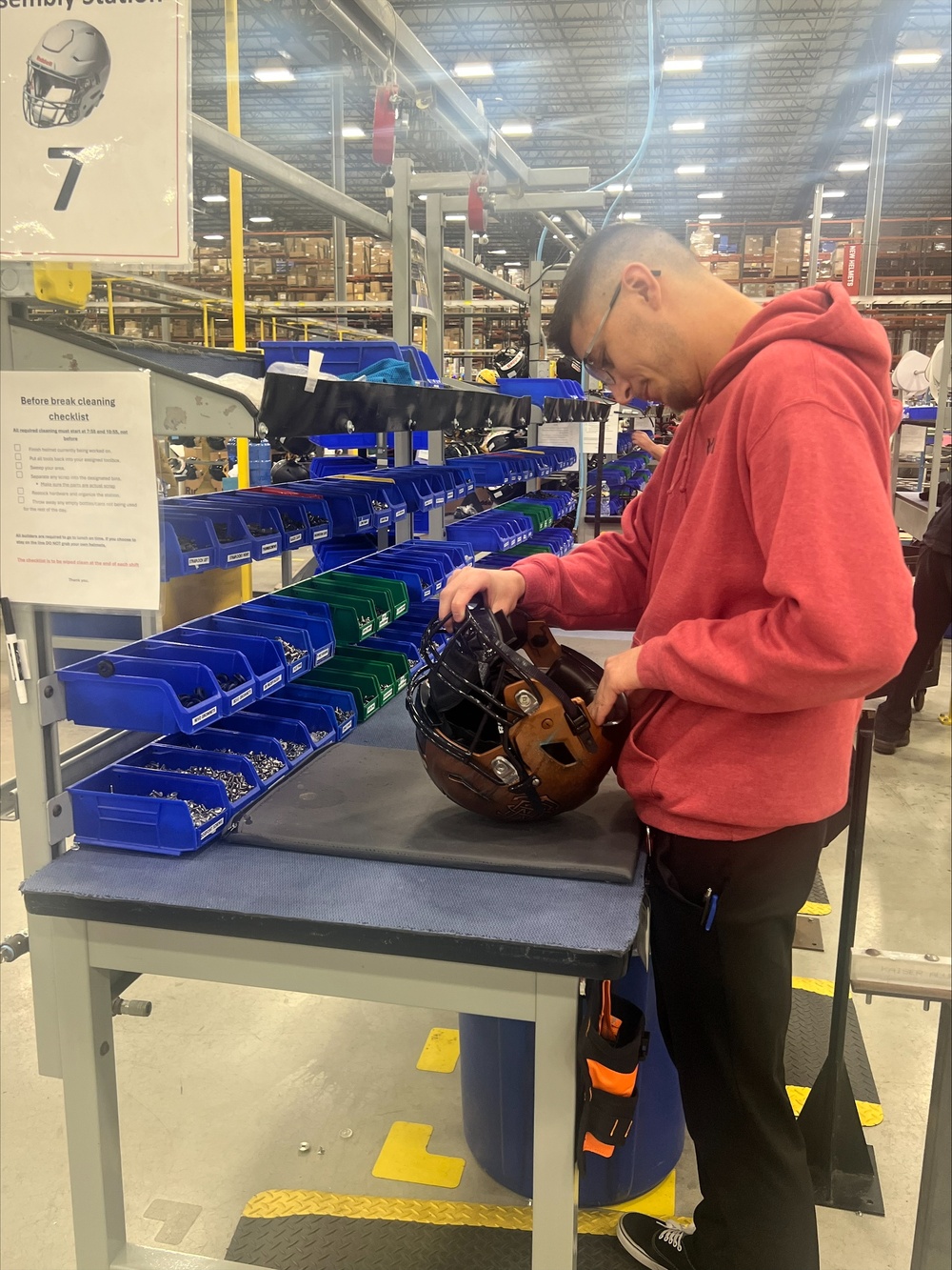 Future Sailor from NTAG ORV works on helmet for annual Army Navy game