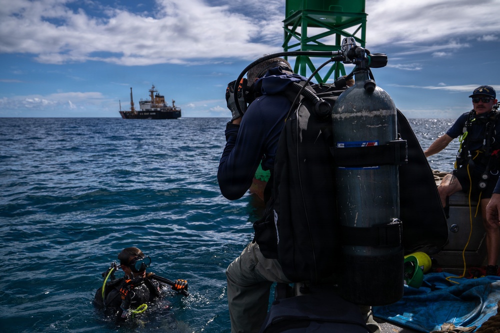 U.S. Coast Guard divers conduct aids to navigation operations
