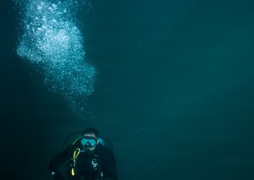 U.S. Coast Guard divers conduct aids to navigation operations