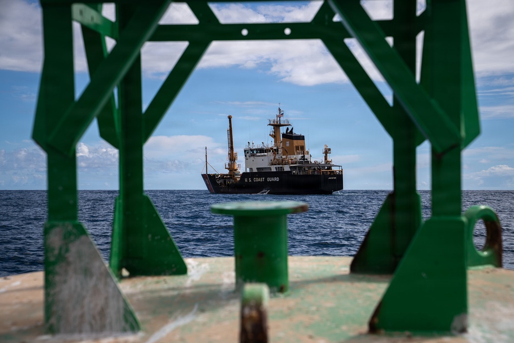 U.S. Coast Guard divers conduct aids to navigation operations