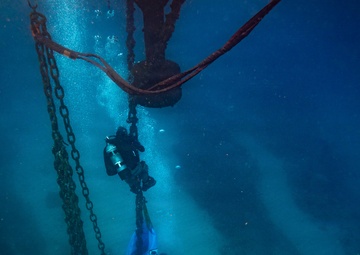 U.S. Coast Guard divers conduct aids to navigation operations