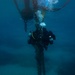 U.S. Coast Guard divers conduct aids to navigation operations