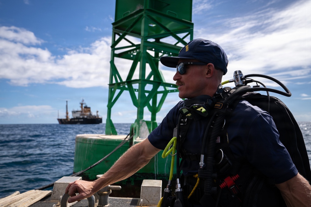 U.S. Coast Guard divers conduct aids to navigation operations
