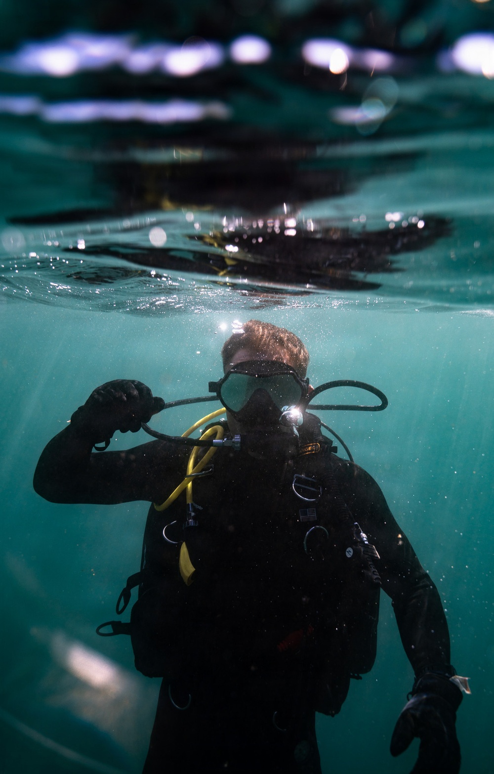 U.S. Coast Guard divers conduct aids to navigation operations