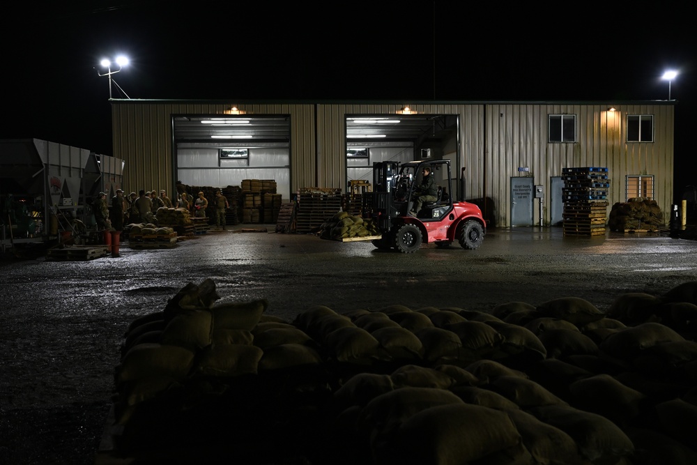 Guard personnel conduct sand bag filling operations in Skagit County