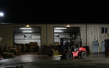 Guard personnel conduct sand bag filling operations in Skagit County