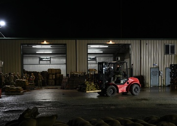 Guard personnel conduct sand bag filling operations in Skagit County
