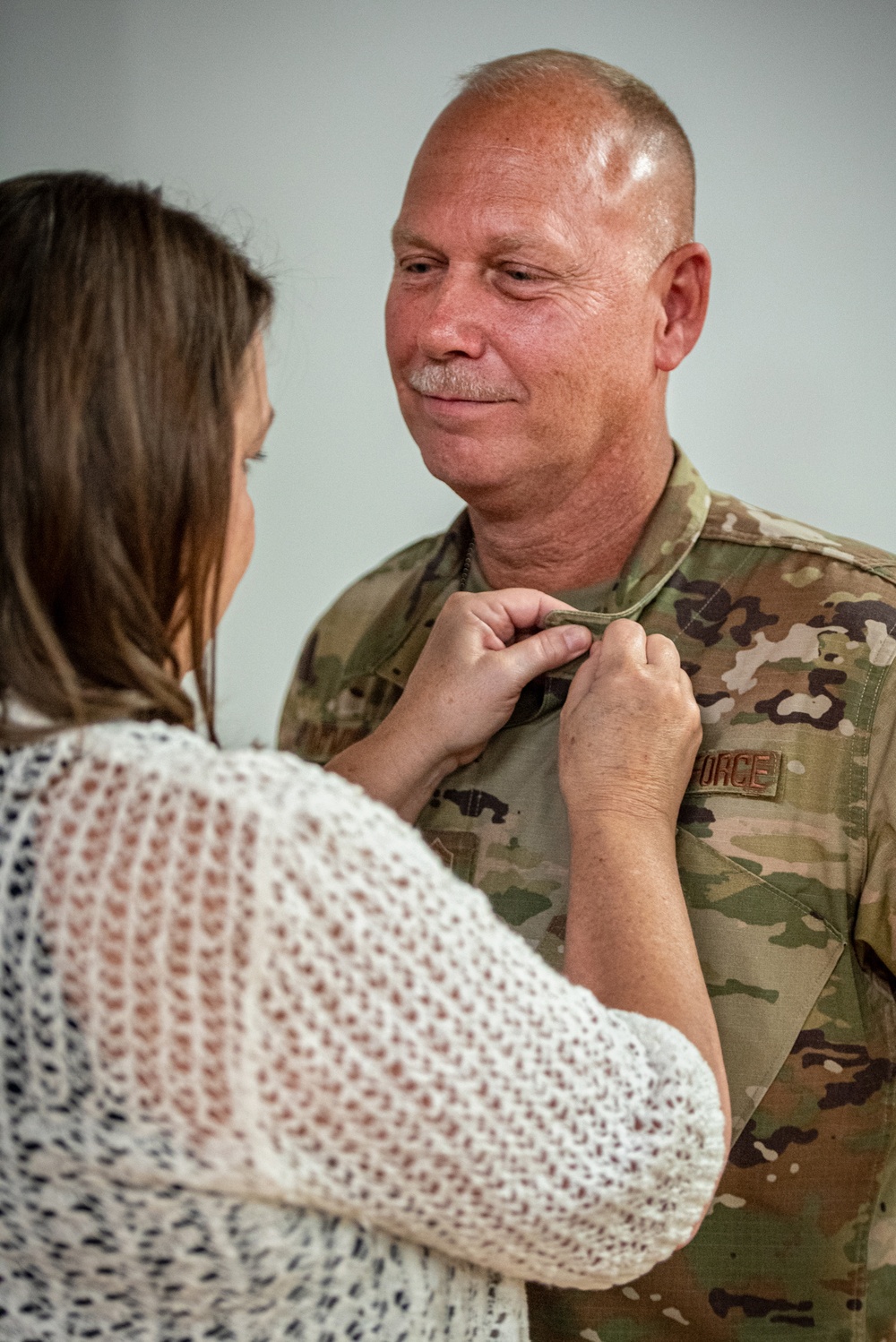 Raymond retires, concluding more than two decades of military service