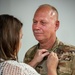 Raymond retires, concluding more than two decades of military service