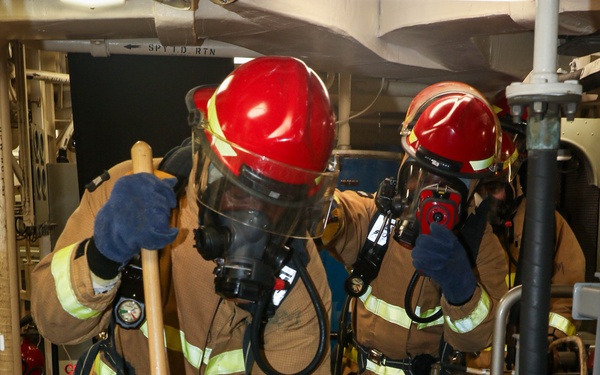 Frank E. Petersen Jr. conducts main space fire drill