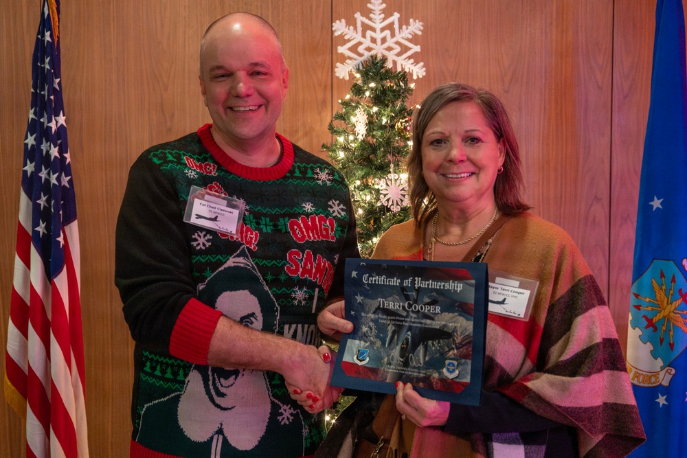92nd ARW celebrates holidays, inducts new Honorary Squadron Commanders