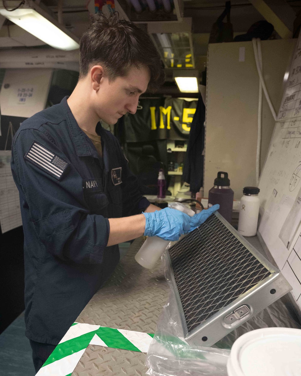Nimitz Sailor Performs Maintenance On Air Conditioner Filter