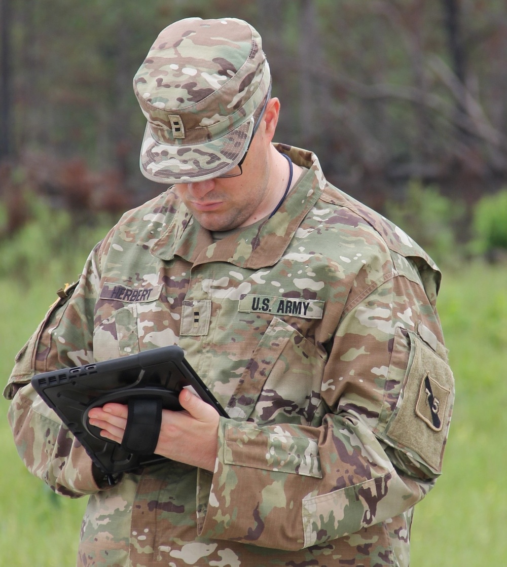 Chief Warrant Officer 2 Sean Herbert, 75th U.S. Army Reserve Innovation Command evaluates technology during Cyber Quest 25 on June 10, 2025, at Fort Eisenhower, Georgia. New acquisition reform accelerates delivery of cutting-edge tools, ensuring Soldiers get mission critical capabilities into their hands faster.