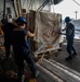 Nimitz Sailors Onload Cargo During A Replenishment At Sea