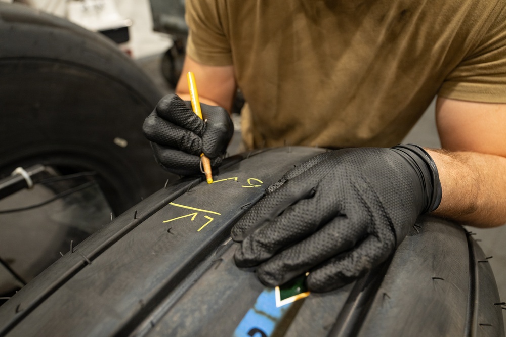 379th Expeditionary Maintenance Squadron maintainers inspect and repair KC-135 Stratotanker aircraft wheel and tire