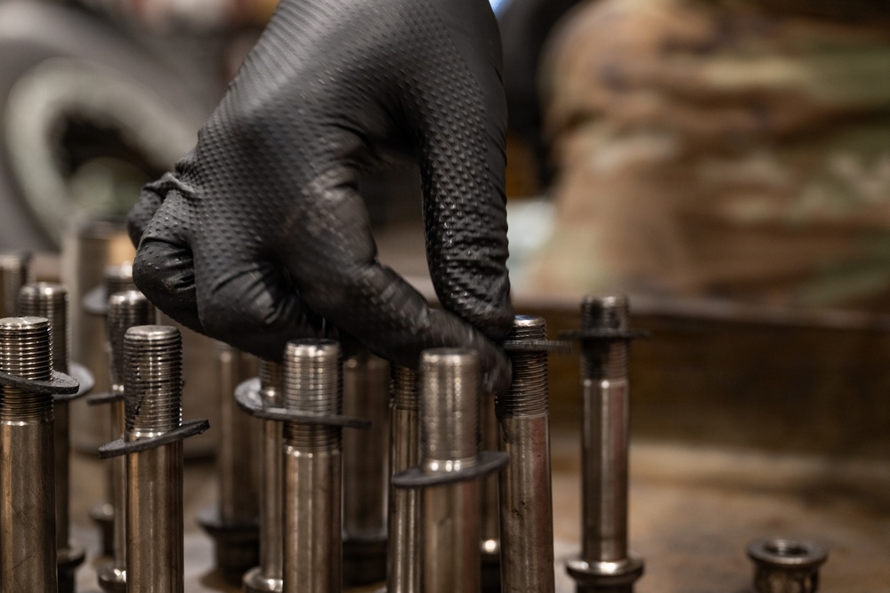 379th Expeditionary Maintenance Squadron maintainers inspect and repair KC-135 Stratotanker aircraft wheel and tire