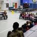 Aircrew flight equipment technicians introduce elementary students to motion, matter with parachutes