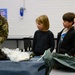 Aircrew flight equipment technicians introduce elementary students to motion, matter with parachutes