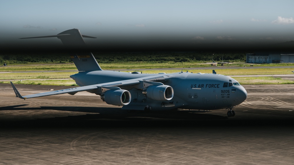 346th AEW offloads lowboy trailer from C-17