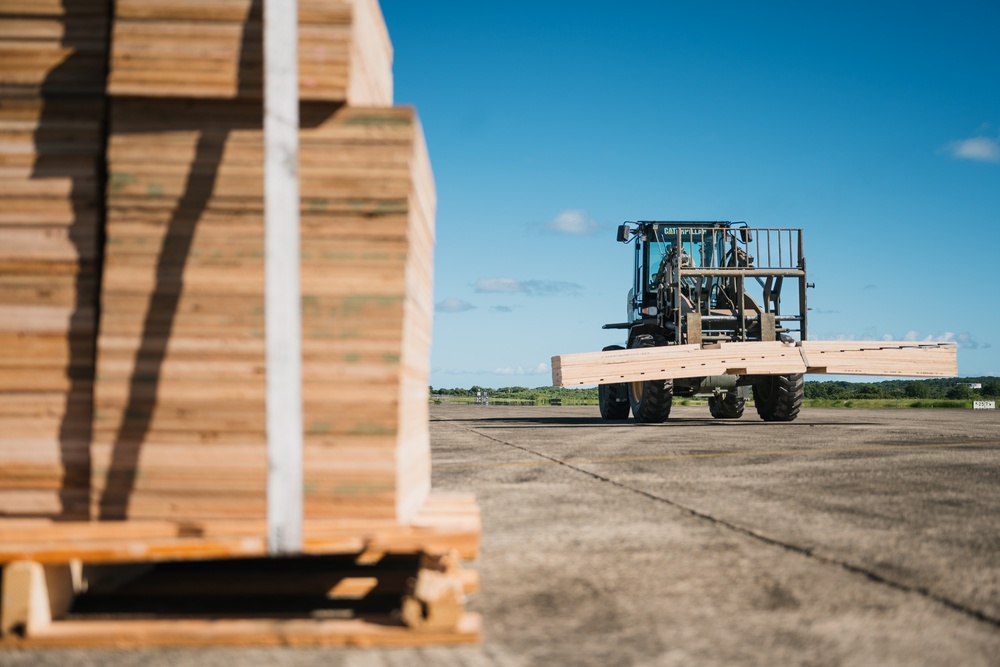 346th AEW offloads lowboy trailer from C-17