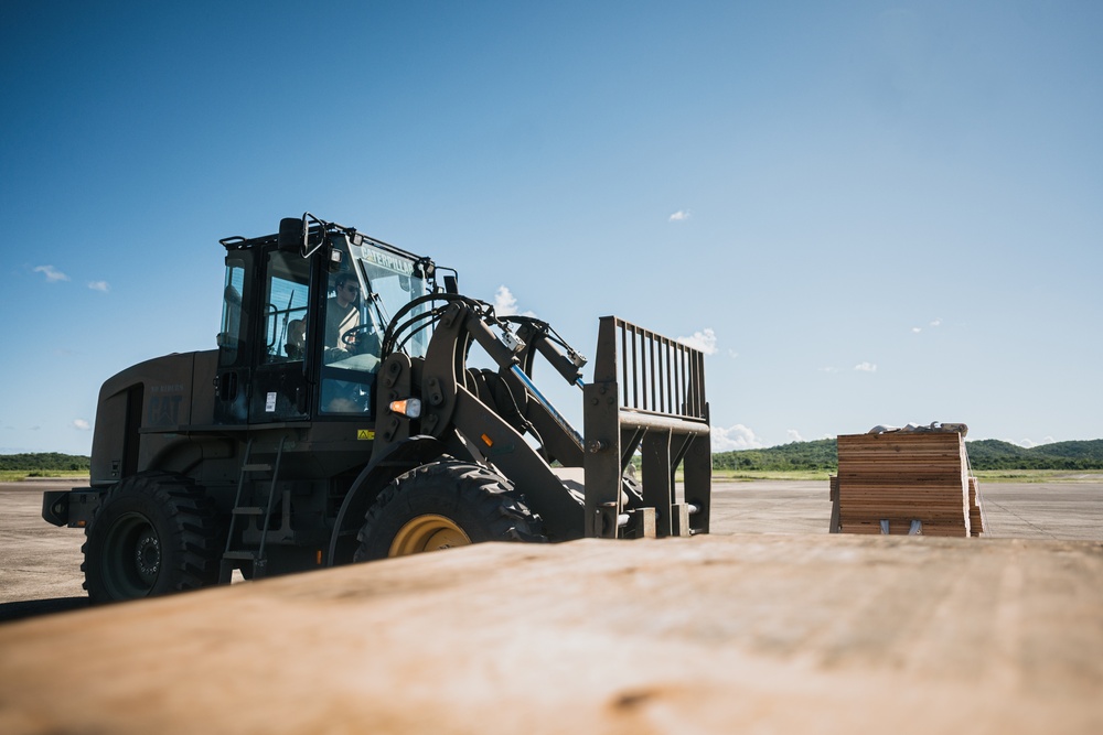346th AEW offloads lowboy trailer from C-17