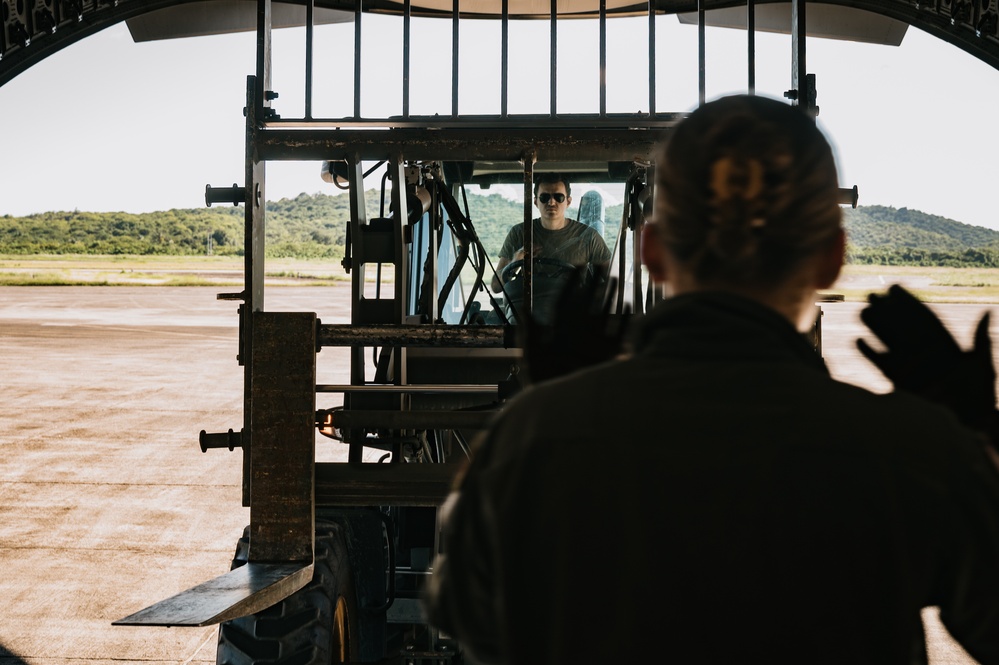 346th AEW offloads lowboy trailer from C-17