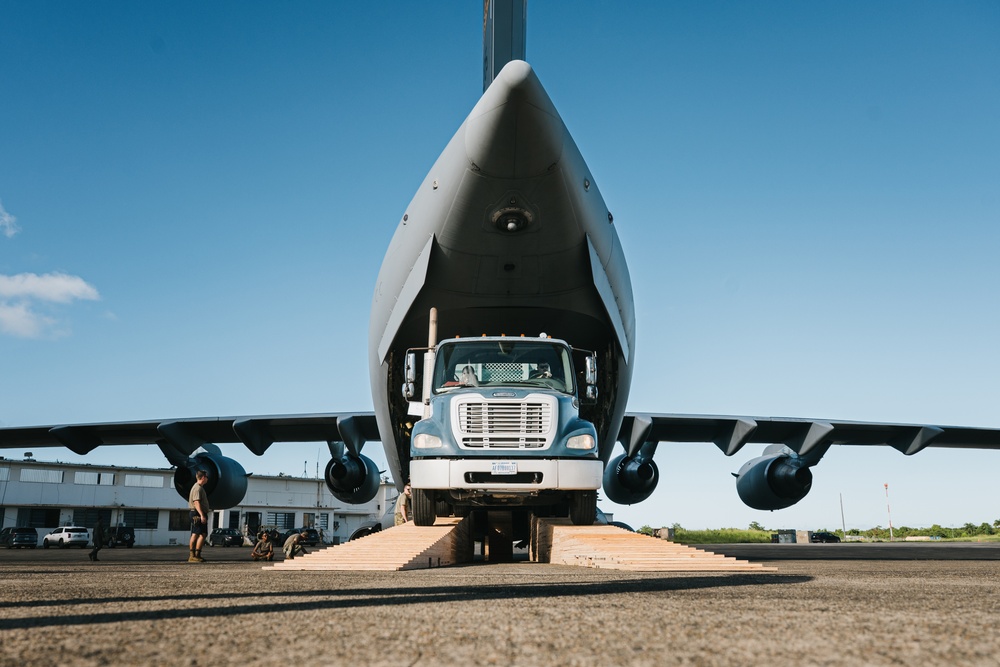 346th AEW offloads lowboy trailer from C-17