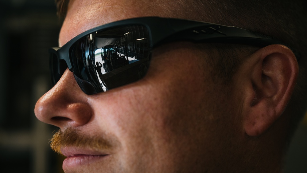 346th AEW offloads lowboy trailer from C-17