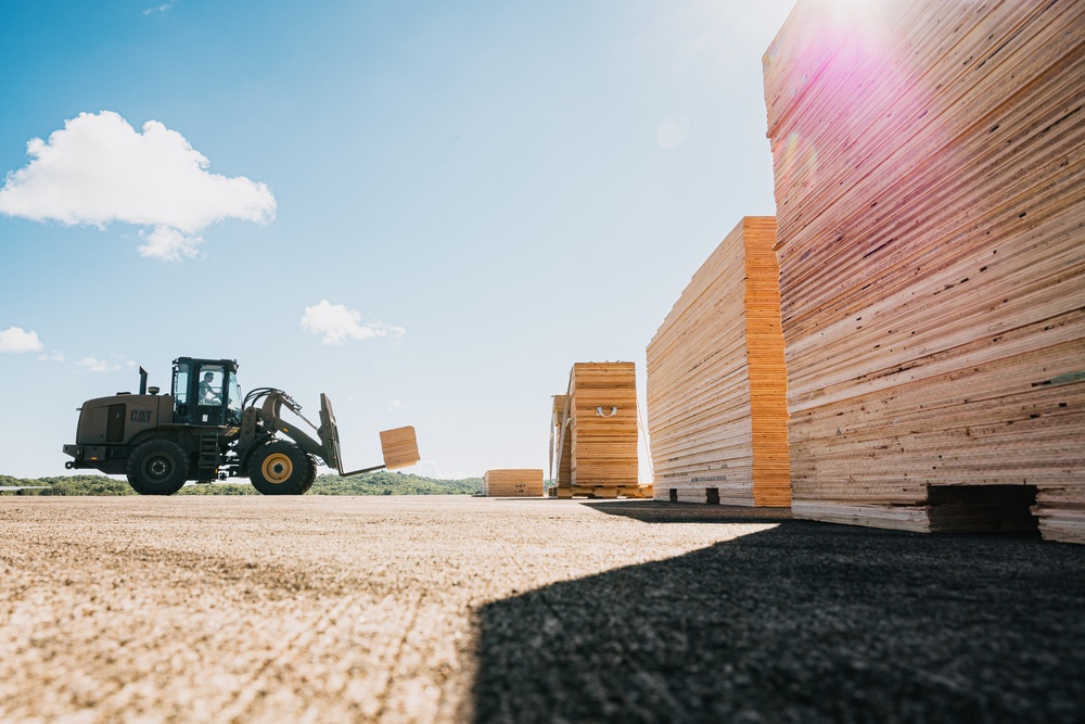 346th AEW offloads lowboy trailer from C-17