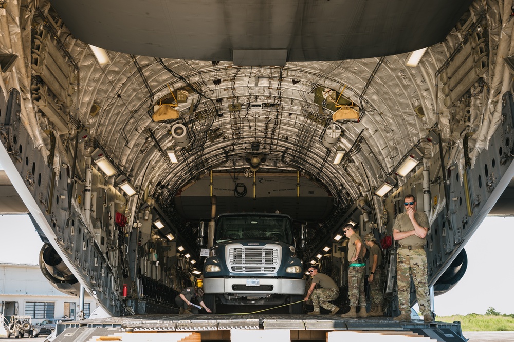 346th AEW offloads lowboy trailer from C-17